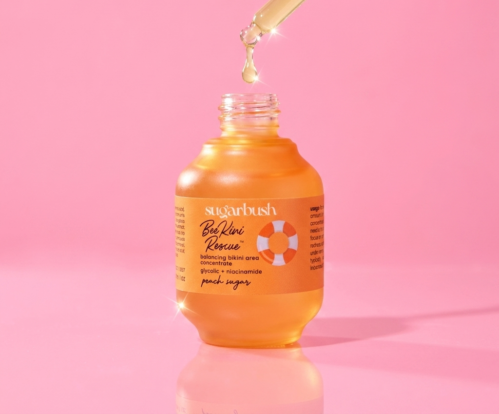 BeeKini Rescue ingrown hair serum with niacinamide — open, dropper detail, Sugarbush signature pink
