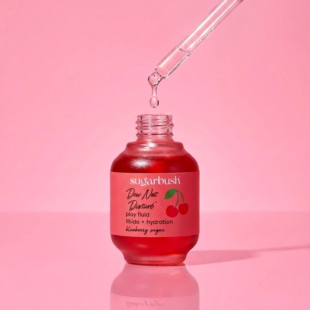 Dew Not Disturb play fluid — open, dropper detail, Sugarbush signature pink